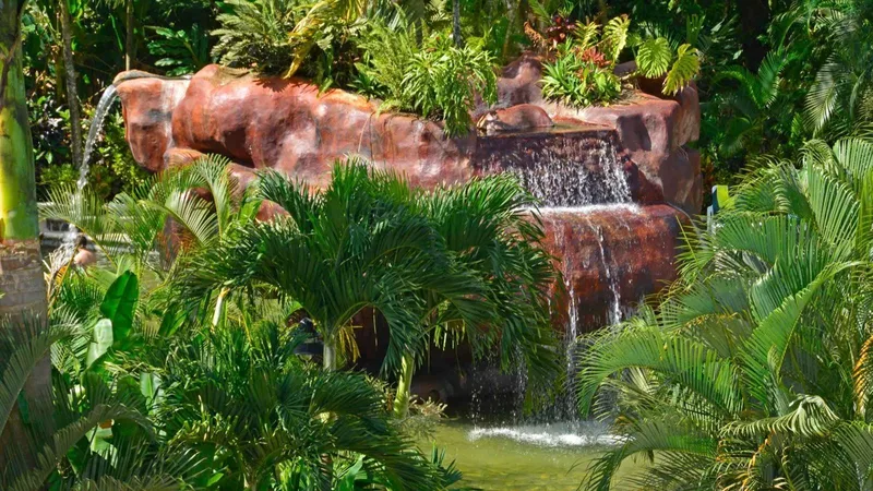 Visitors relaxing in a thermal pool at Baldi Hot Springs near La Fortuna, Costa Rica