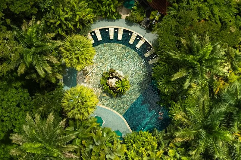 Loungers beside a thermal pool at Paradise Hot Springs near La Fortuna, Costa Rica