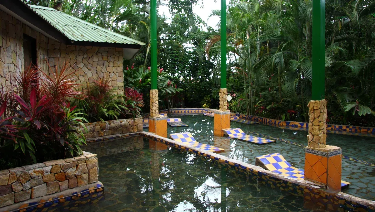 Tiled thermal pools under palms at Baldi, La Fortuna hot springs, Costa Rica