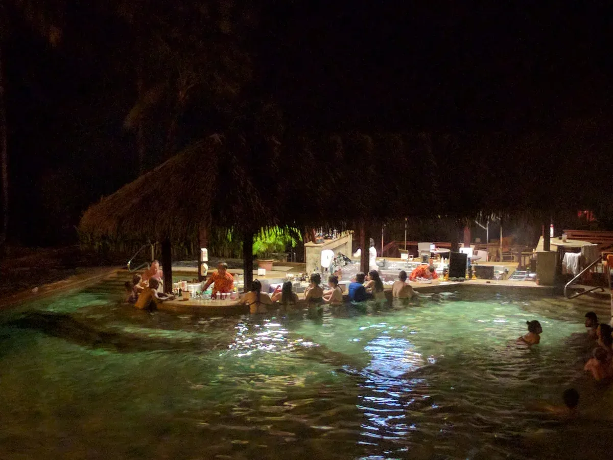 The swim-up bar in a thermal pool at Tabacón at night, La Fortuna hot springs, Costa Rica
